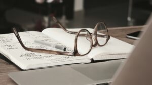 eyeglasses on an open journal